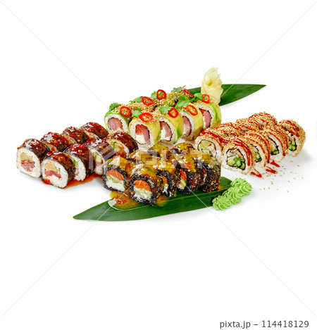 Vibrant assortment of sushi rolls on bamboo leaves on white 114418129