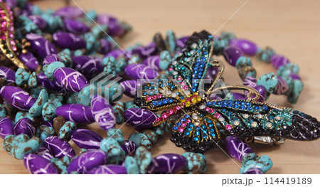 Southwestern Style Jewelry on Wooden Table With Rustic Decor Southwestern Style Jewelry on Wooden Table With Rustic Decor 114419189