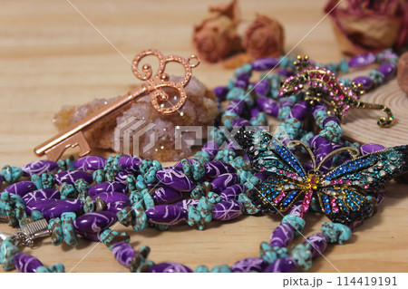 Southwestern Style Jewelry on Wooden Table With Rustic Decor 114419191