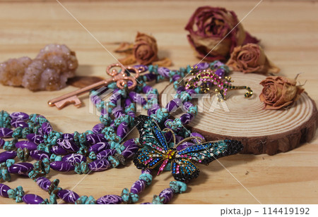 Southwestern Style Jewelry on Wooden Table With Rustic Decor 114419192