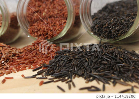Different Rice Varieties in Rustic Kitchen. Different Rice Varieties in Rustic Kitchen. 114419200