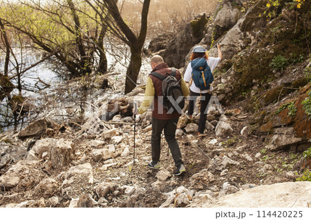senior friends tourists outdoor adventure together on mediterranian sea landscape senior friends tourists outdoor adventure together on mediterranian sea landscape 114420225