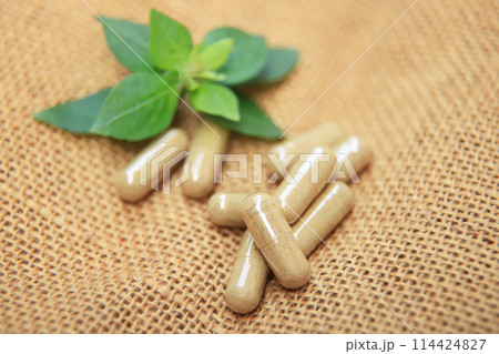 Herbal capsules medicine from green herb for healthy eating in daily life 114424827