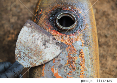 removing old color surface on metal for new painting in fixing car working removing old color surface on metal for new painting in fixing car working 114424851