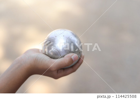 Kid hand hold metal ball in playing sport in free time for learning Kid hand hold metal ball in playing sport in free time for learning 114425508