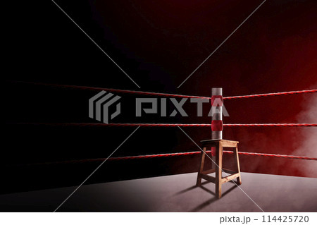 An empty seat in the corner of a boxing ring 114425720
