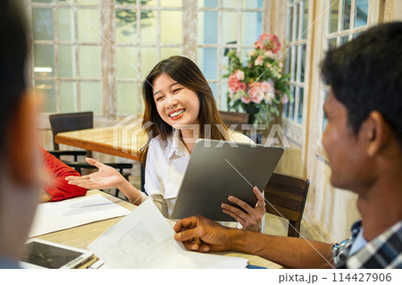 Happy diversity business people smile during a planning, coaching, brainstorming for project meeting in a startup company. 114427906