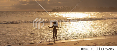 Carefree Running Bikini Beach Woman Near Ocean During Summer Vaacation 114429265