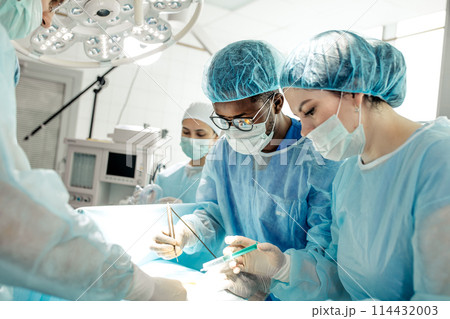 cute assistant giving injection, anasthetizing the pain 114432003