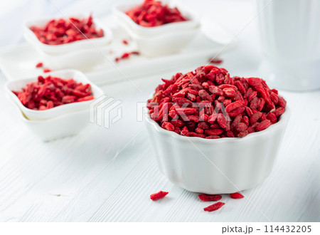 Dried goji berries on a white table. Dried goji berries on a white table. 114432205