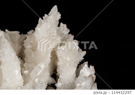 Macro stone Calcite mineral on a black background 114432297