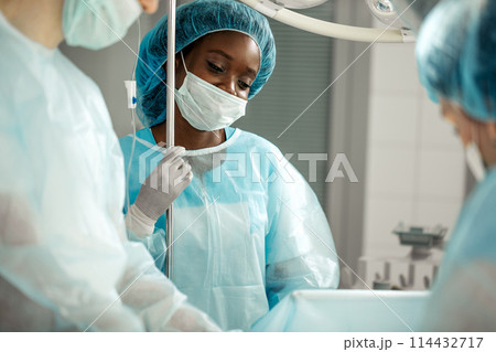 good looking awesome nurse enjoying her job good looking awesome nurse enjoying her job 114432717