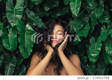 Natural Hair Care Portrait of Young Woman in Exotic Tropical Foliage Natural Hair Care Portrait of Young Woman in Exotic Tropical Foliage 114432799