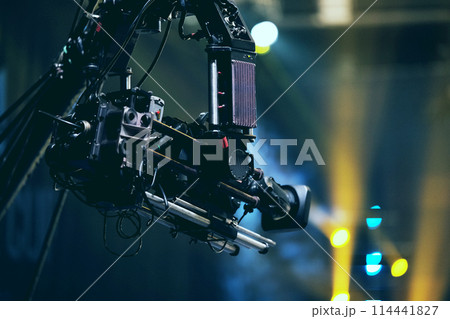 TV camera on a crane at a football match or concert. Close-up live video broadcast camera 114441827