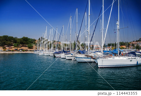 Coastal town and marina with boats and clear blue sky. European travel and vacation concept 114443355