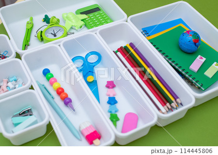 School supplies.Concept back to school. colored stationery is arranged in white organizers. Creative Drawer Organizing. Storage office supplies School supplies.Concept back to school. colored stationery is arranged in white organizers. Creative Drawer Organizing. Storage office supplies 114445806
