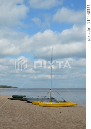 Inflatable catamarans on the lake shore. 114448588
