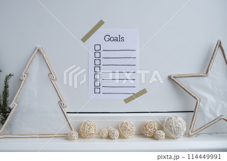Paper note with inspirational to do checklist GOALS with natural zero waste homemade Christmas decor. Happy new year promises resolutions. Self growth and personal development Paper note with inspirational to do checklist GOALS with natural zero waste homemade Christmas decor. Happy new year promises resolutions. Self growth and personal development 114449991