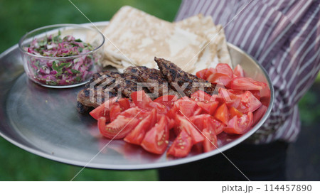 grilled lamb kebab meat serving on a steel plate grilled lamb kebab meat serving on a steel plate 114457890