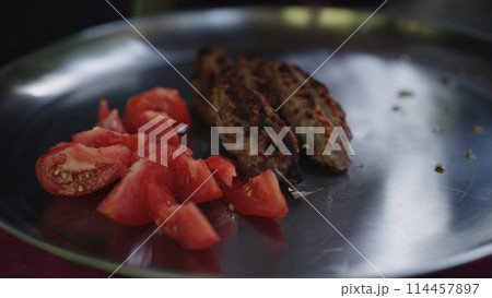 grilled lamb kebab meat serving on a steel plate 114457897
