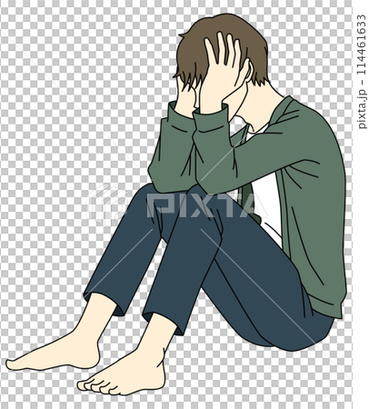 A man sitting on the floor with his head in his hands and worried 114461633