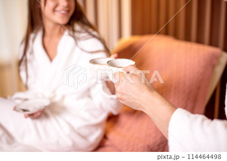 young couple selebrating a honey mood in the hotel room young couple selebrating a honey mood in the hotel room 114464498