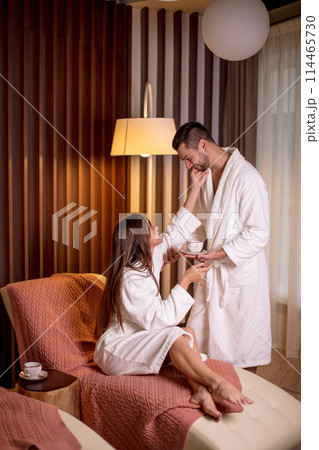 young awesome girl thanking her boyfriend for coffee in the morning indoors 114465730