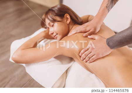 positive girl spending time in the spa center 114465876