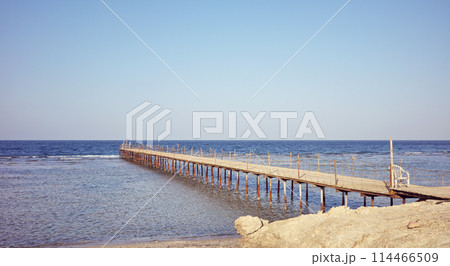 Old wooden pier at the sea, color toning applied. 114466509