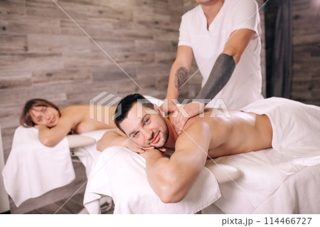 popular therapy. masseur practicing back massage 114466727