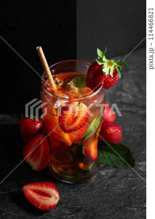 Summer refreshing drink with ice, mint, and strawberries. 114466821