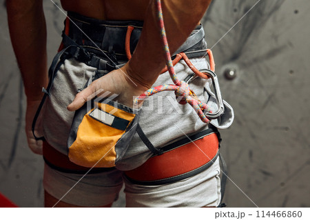 Climber s male hands with equipment during preparation for climb, close-up. Climber s male hands with equipment during preparation for climb, close-up. 114466860