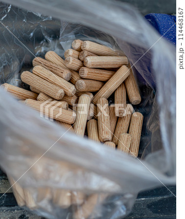 furniture pegs in a bag on the floor at the workplace furniture pegs in a bag on the floor at the workplace 114468167