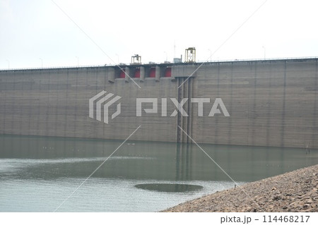 Khun Dan Prakarn Chon huge concrete dam with lower water level from El nino effect in Thailand Khun Dan Prakarn Chon huge concrete dam with lower water level from El nino effect in Thailand 114468217