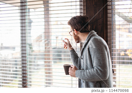 Young couple watching video online in a tablet relaxing home together. 114470098