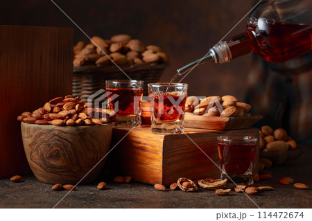 Italian liqueur Amaretto with almonds nuts. Italian liqueur Amaretto with almonds nuts. 114472674