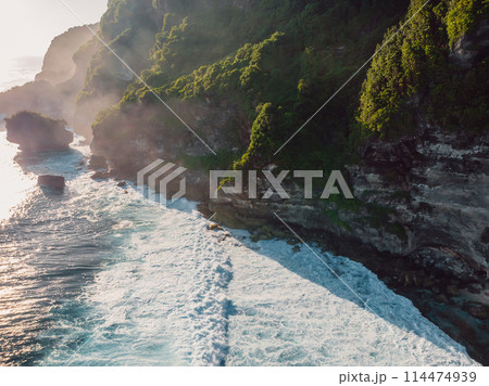 Rocky coastline with ocean waves. Scenic landscape with cliff shoreline. Drone view. Rocky coastline with ocean waves. Scenic landscape with cliff shoreline. Drone view. 114474939
