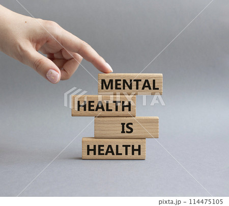 Mental Health symbol. Wooden blocks with words Mental Health is Health. Beautiful grey background. Doctor hand. Medical and Health concept. Copy space. 114475105