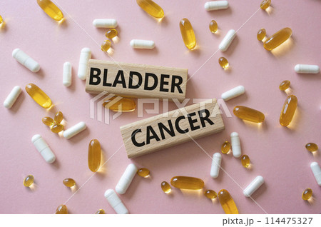 Bladder Cancer symbol. Concept word Bladder Cancer on wooden blocks. Beautiful pink background with pills. Medicine and Bladder Cancer concept. Copy space Bladder Cancer symbol. Concept word Bladder Cancer on wooden blocks. Beautiful pink background with pills. Medicine and Bladder Cancer concept. Copy space 114475327