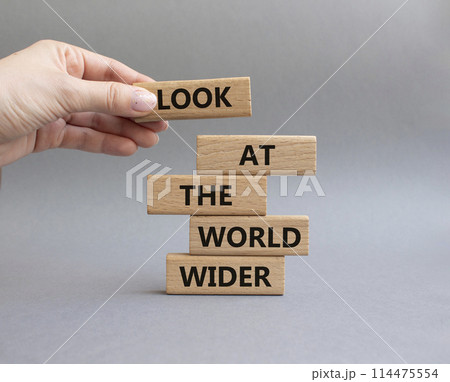 Look at the world wider symbol. Wooden blocks with words Look at the world wider. Beautiful grey background. Businessman hand. Business and Look at the world wider concept. Copy space. Look at the world wider symbol. Wooden blocks with words Look at the world wider. Beautiful grey background. Businessman hand. Business and Look at the world wider concept. Copy space. 114475554