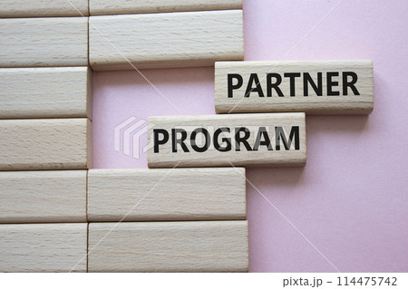 Partner Program symbol. Wooden blocks with words Partner Program. Beautiful pink background. Business and Partner Program concept. Copy space. Partner Program symbol. Wooden blocks with words Partner Program. Beautiful pink background. Business and Partner Program concept. Copy space. 114475742