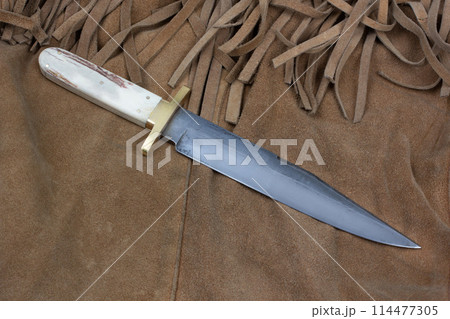 Old west bowie knife on leather jacket Old west bowie knife on leather jacket 114477305