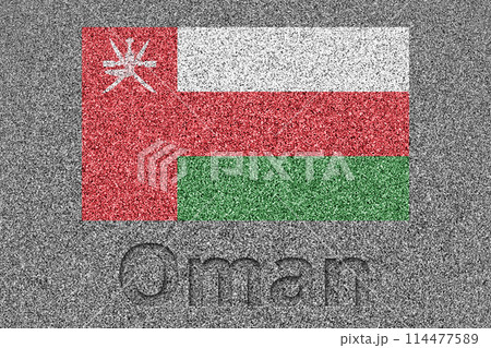 石板の上に描かれたオマーンの国旗と、掘ったような「Oman」の文字 114477589
