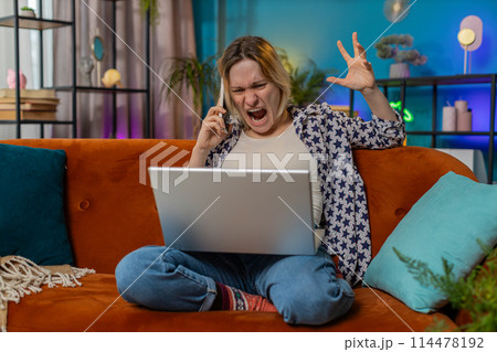 Furious annoyed young woman freelancer engage in heated phone conversations quarrel frustration Furious annoyed young woman freelancer engage in heated phone conversations quarrel frustration 114478192
