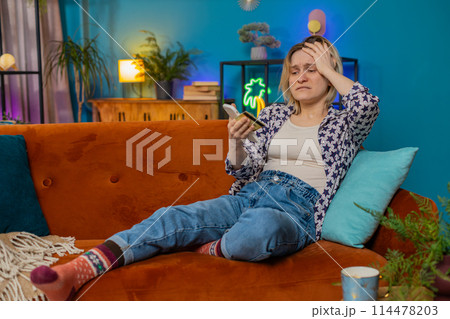 Angry stressed woman trying to pay online shopping with smartphone blocked credit card smartphone 114478203