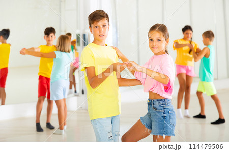 Group of kids dancing salsa in studio Group of kids dancing salsa in studio 114479506