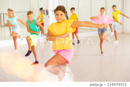 Dance studio - girls and boys in dance lesson 114479551