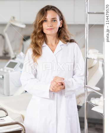 Skilled cosmetic doctor confidently stands 114479570
