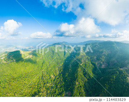 Beautiful view of tropical islands. Mountains and hills of a tropical island covered with jungle  114483829