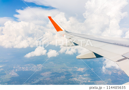 View from the airplane window during taking off on a clear summer morning 114485635